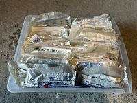 Top view of tray filled with envelopes containing stamps