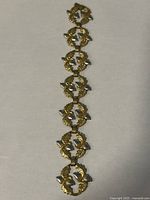 Full view of bracelet laid flat showing all linked sections