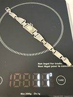 Full bracelet on scale showing weight