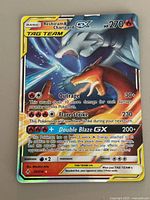Front of Reshiram & Charizard GX Tag Team card showing artwork, attacks, set number