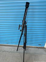 Full view of Tasco refractor telescope on tripod