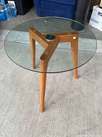 Full view of teak base and glass top side table