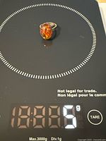 Ring on scale showing 5 g weight