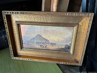 Front view of framed landscape artwork