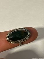 Top view showing oval cabochon, marcasite border, silver setting