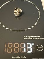 Ring on scale showing 13.83 g weight