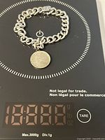 Bracelet on digital scale reading ~39 g