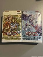 Front view of both sealed Structure Deck boxes