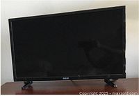 Front view of RCA 24-inch TV on stand