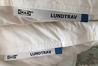 Ikea Lundtrav labels on two pillows