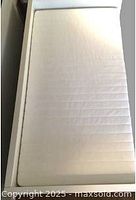 Foam mattress placed in daybed frame