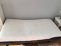 Full view of the twin mattress showing quilted white top