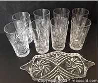 Six tall cut crystal tumblers and matching divided relish tray