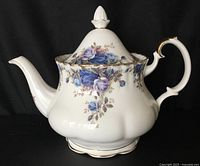 Right side view of teapot showing pattern, shape and handle