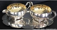 creamer and sugar bowl on tray, top view shows gilt interiors and tray shape