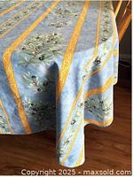 Tablecloth draped on table showing full pattern and colors