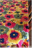 Full view of tablecloth on table showing overall floral pattern