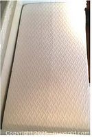 Top surface of twin mattress showing quilted pattern