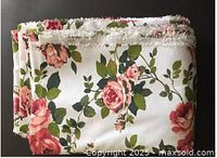 Folded rose floral upholstery fabric piece
