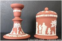 Candlestick and lidded jar front view