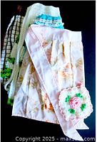 Stacked aprons and crochet potholder showing colors and patterns