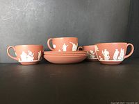 Group view of four teacups and four saucers