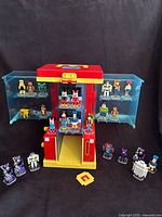 Full view of open display case showing figures, question boxes and coin