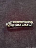 Angled perspective of bracelet to highlight dimensional pyramid links and oxidized finish