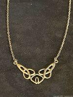 Close-up of abstract openwork pendant on chain