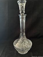 Full view of cut crystal decanter with stopper in place