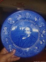 front view showing Dickens portrait, character vignettes, blue transfer design