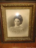 Front view of framed portrait showing subject and frame details