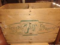 Front view showing 7 Up logo, slogan, and wood grain