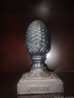 Front view showing full pinecone finial and Nuvo Iron stamp