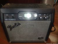 Front view showing Fender logo, LCD screen, controls