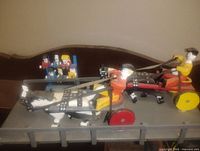 Overall view of carved horse race sculpture with audience