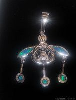 Front view of sterling silver bumblebee pendant with opal wings and dangling opal drops