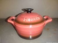 Front view of covered dish showing color gradient and Hearth branding