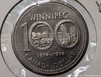Reverse side showing WINNIPEG 100 1874-1974 CANADA DOLLAR design