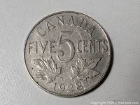 Reverse side showing CANADA, large 5, maple leaves, date 1928