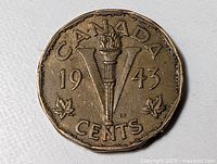 Reverse showing torch, V, maple leaves and date 1943