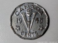 Reverse showing CANADA, V torch, date 1945, and denomination