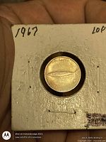 Obverse side of 1967 Canadian silver dime in 2×2 holder