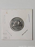 Reverse of 1977 Canada 5-cent coin showing beaver and date inside 2x2 holder