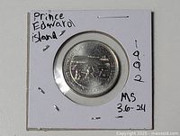 Full view of coin in 2×2 holder showing both obverse and holder markings