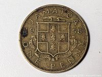 Reverse of 1958 Jamaica One Penny showing coat of arms and date
