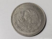 Obverse showing eagle with snake, clear legends