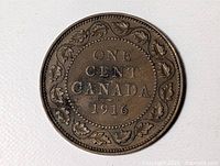 Reverse of 1916 Canadian one-cent coin showing ONE CENT CANADA and date 1916 within maple-leaf wreath