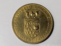 Obverse with Northwest Territories coat of arms and bilingual legend