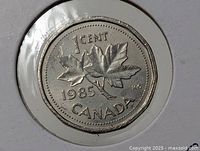 Reverse of 1985 silver-tone 1 cent Canada coin in holder